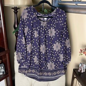 Loose fitting comfortable yet put together top.